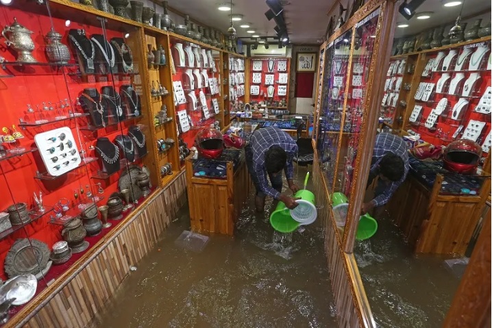 Nearly half a dozen shops inundated in Srinagar’s Polo View market after overnight rainfall